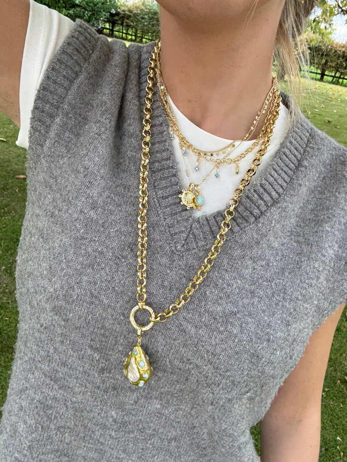 Cool jewellery stack with chunky gold necklaces