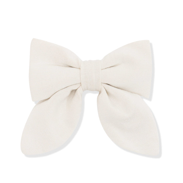 Large cream-colored bow on a white background