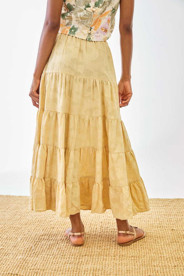 Rear view of model wearing NKN Nekane Riloru Yellow Long Linen Ruffled Skirt by nkn nekane, shop nkn nekane at Dotique
