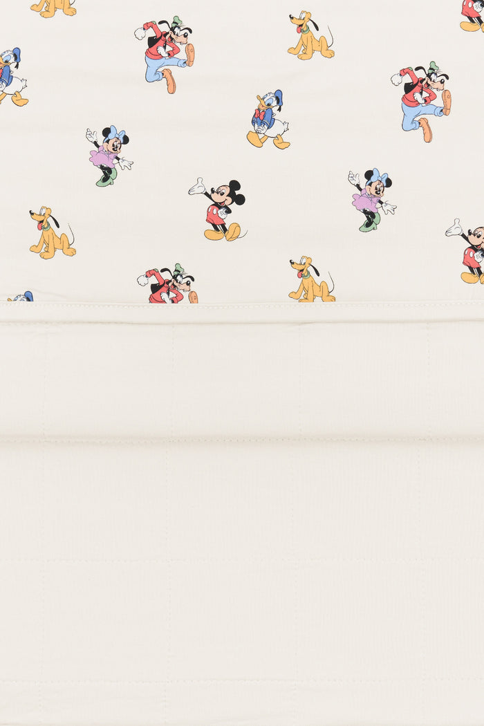 Back side fabric of Toddler Blanket in Mickey Mouse and Friends print on an oat background