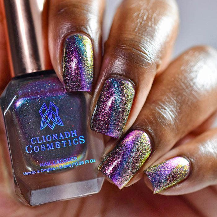 Close up nails done with Warped nail lacquer featuring a design to show off the magnetic feature on deep skin tone