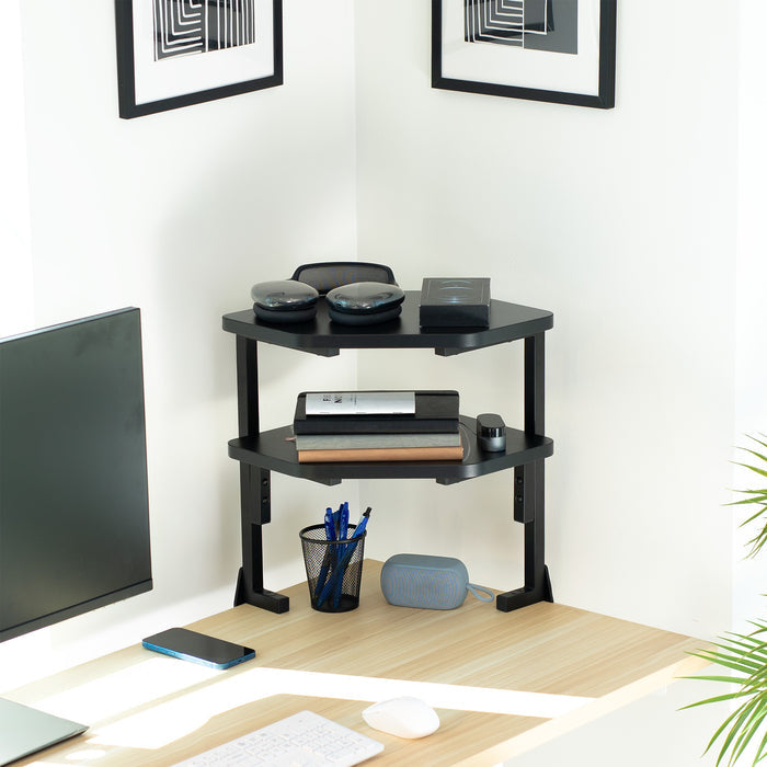 Black corner desk shelf with office items in a home office setting