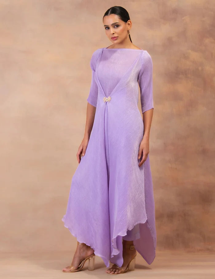 Model wearing the 'AMETHYST FLOW' layered tunic drape-dress set with matching pants, crafted in micro-pleated georgette satin with gold foil detailing.