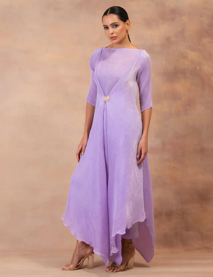 Model wearing the 'AMETHYST FLOW' layered tunic drape-dress set with matching pants, crafted in micro-pleated georgette satin with gold foil detailing.
