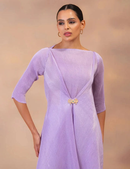 Model wearing the 'AMETHYST FLOW' layered tunic drape-dress set with matching pants, crafted in micro-pleated georgette satin with gold foil detailing.