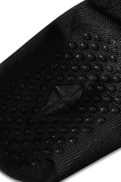 Bottom of sock angled with grips.