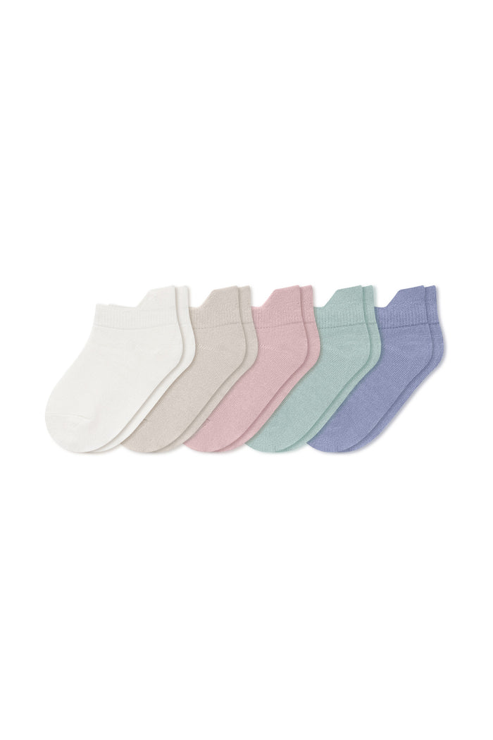 Five pairs of ankle socks in Cloud, Oat, Blush, Sage, and Haze laying flat on a white background.
