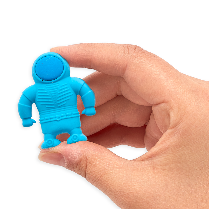 Hand holding up blue astronaut eraser