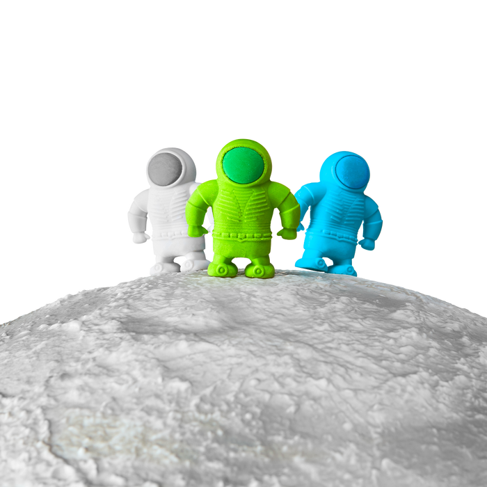 3 Astronaut Erasers shown standing on a planet top edge