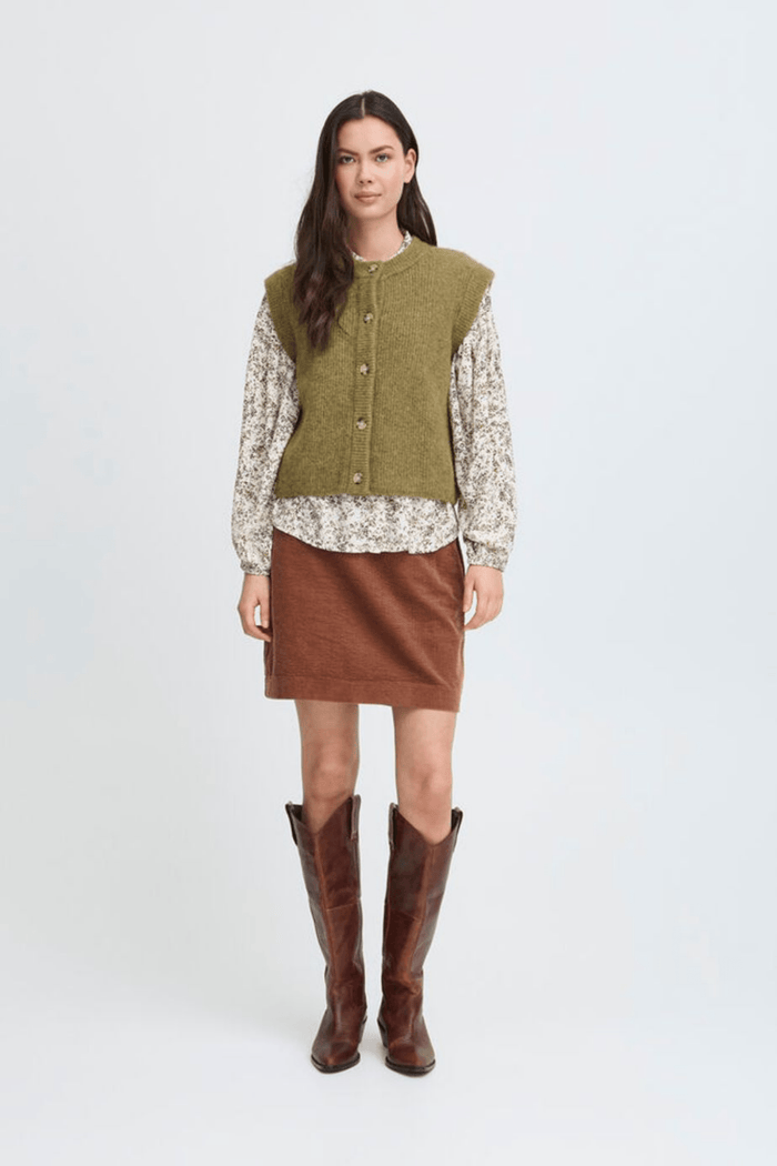 Atelier Rêve Irsilvi Waistcoat, crafted in a cosy moss melange green knit. Available at Dotique Witney