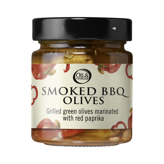 A jar of BBQ Olives with a label that reads 'SMOKED BBQ OLIVES' and 'Grilled green olives marinated with red paprika'.