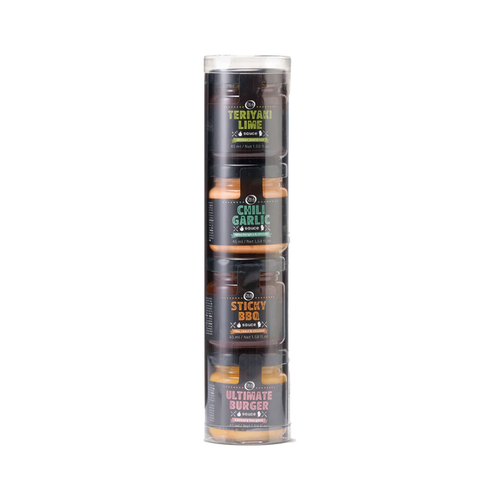 A clear plastic tube containing four small jars of different colored sauces. Each sauce bottle is labeled with a different flavor name.