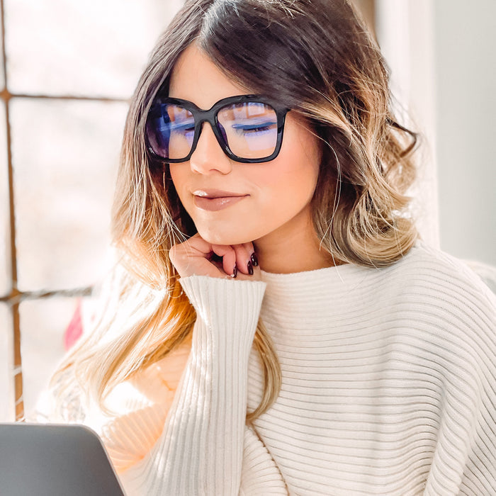on model - female wearing diff eyewear bella square glasses with a black frame and prescription lenses