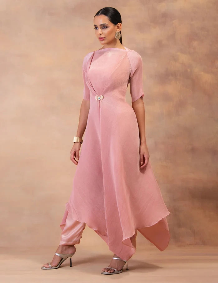 Model wearing the 'BLUSH PINK' layered tunic drape-dress set with matching pants, crafted in micro-pleated georgette satin with gold foil detailing in Singapore.
