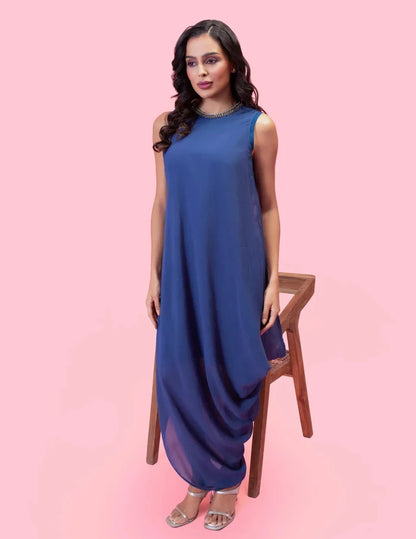 Model wearing the 'BRAHMAND BLUE' ONE SHOULDER DRESS featuring micro-pleated georgette, delicate hand embroidery, and a nature-inspired artistic print in Singapore.