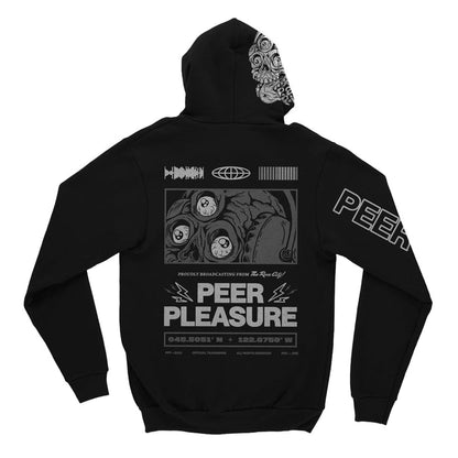 Back of black full zip hoodie. PEER PLEASURE written in white lettering with lightening bolts on the top corners of both sides. A design of a skull wearing headphones with three eyes is above the text. Above the drawing is the soundwave, globe, and barcode drawings. Below the PEER PLEASURE text is coordinates.