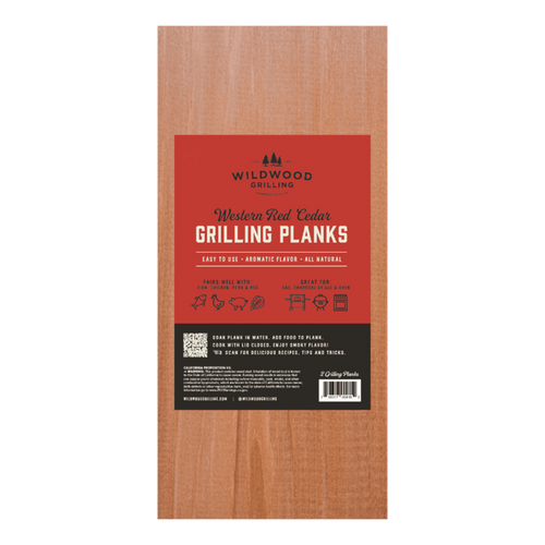 Wooden grilling plank with red label featuring Wildwood Grilling branding.