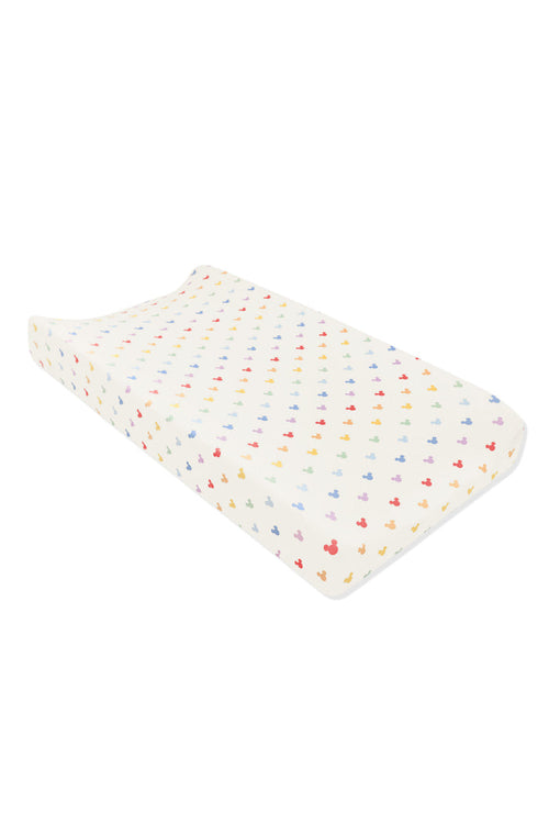 Change pad cover with pastel mickey mouse pattern on an oat background