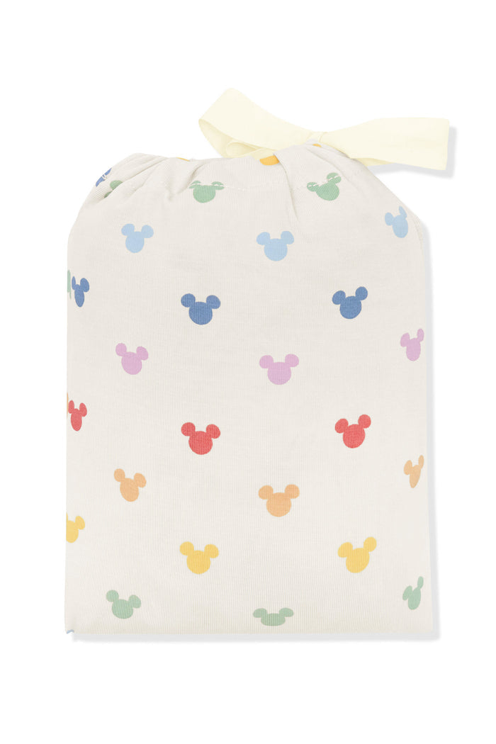 Change pad cover in pastel mickey mouse icons shown in its packaging