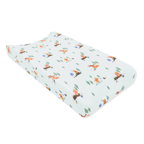 The Change Pad Cover in Winnie the Pooh Hundred Acre Wood shown on a change pad