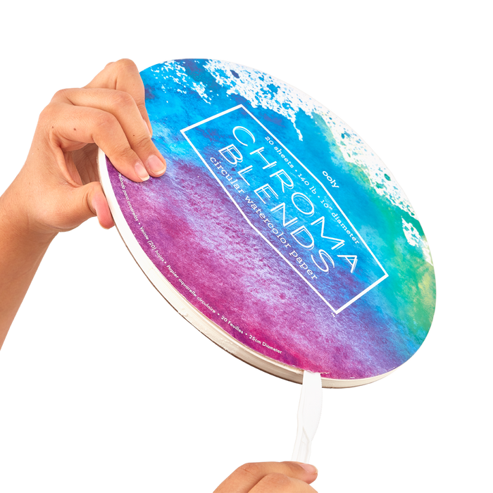 Person demonstrating how to open Chroma Blends Circular Watercolor Paper with a letter opener