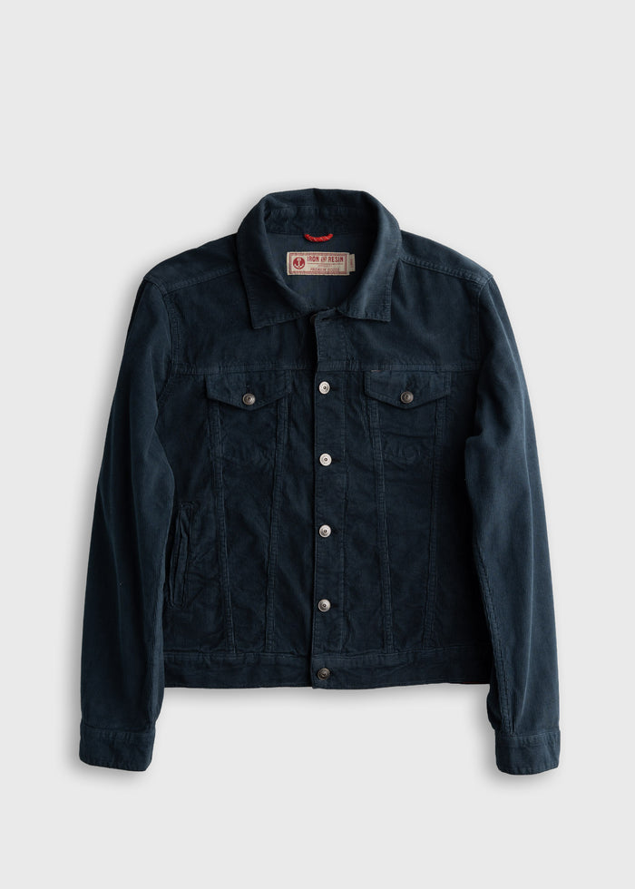 Dark blue denim jacket with button closure and chest pockets, displayed on a plain background.