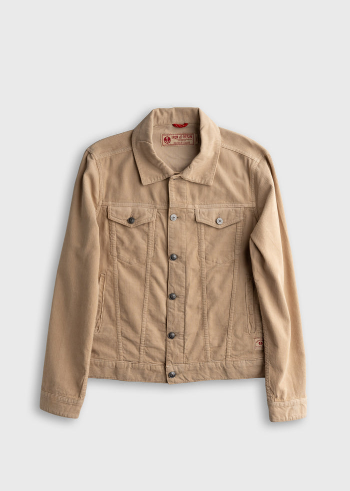 Tan corduroy jacket with button closure and two chest pockets, displayed on a plain background. Casual and stylish design.