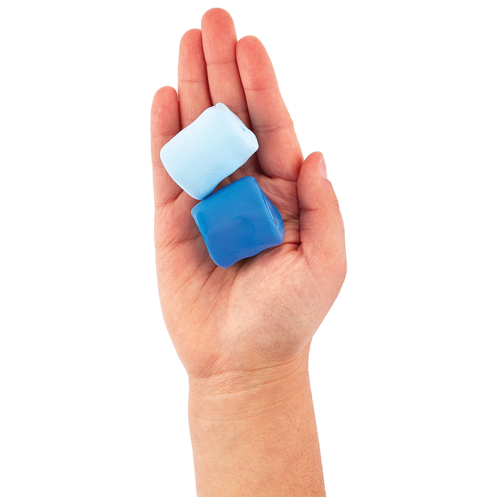 Two blue clay blocks from an OOLY Creatibles Standard Air Dry Clay Kit held in a hand against a white background