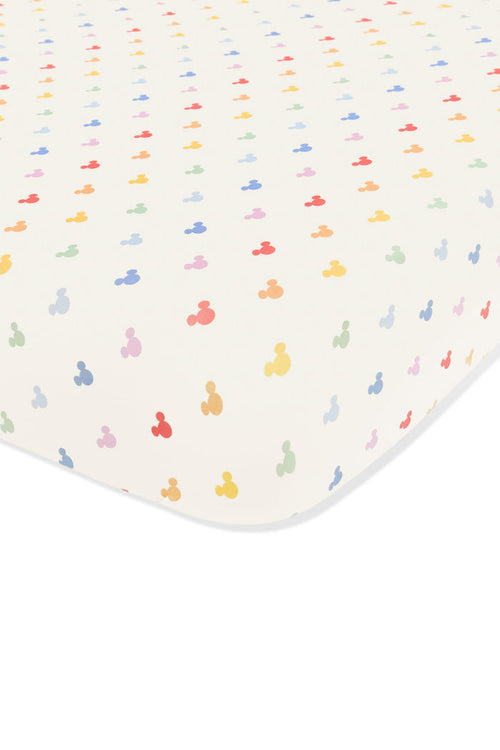 Crib sheet with pastel mickey mouse pattern on an oat background