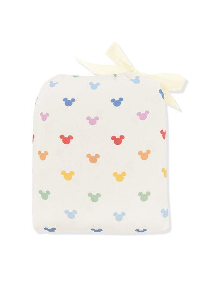 Crib Sheet in pastel mickey mouse print shown in its packaging