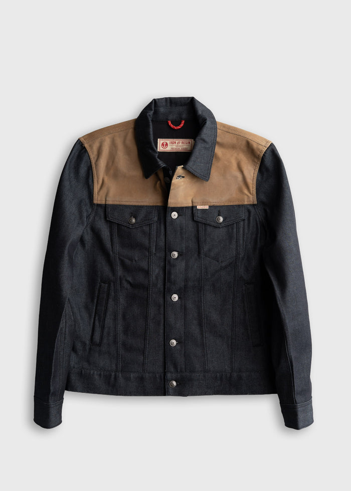 Denim jacket with brown yoke, button closure, and two chest pockets, labeled "Iron and Resin" on a white background.