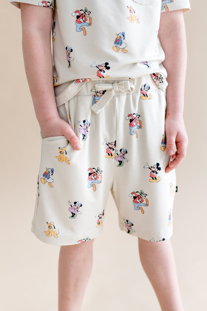 Child wearing Mickey Mouse and Friends printed drawstring shorts with pocket