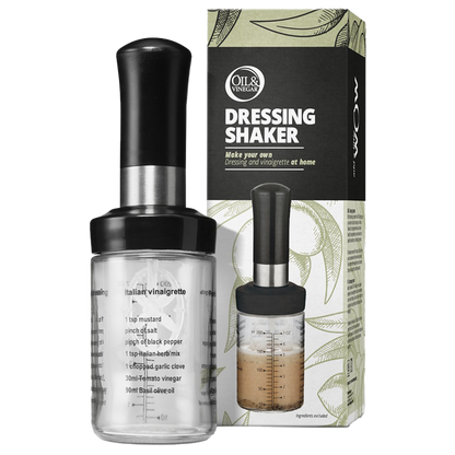 A clear dressing shaker with a black shake handle, displayed alongside its packaging which has 'DRESSING SHAKER' text and recipes written on it.