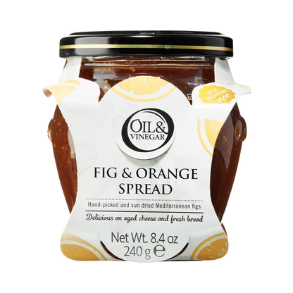 A glass jar of Dried Fig & Orange Spread with a white label that includes the brand 'Oil & Vinegar' and product name. The jar is filled with figs and visible pieces of orange, indicating the flavor of the spread.