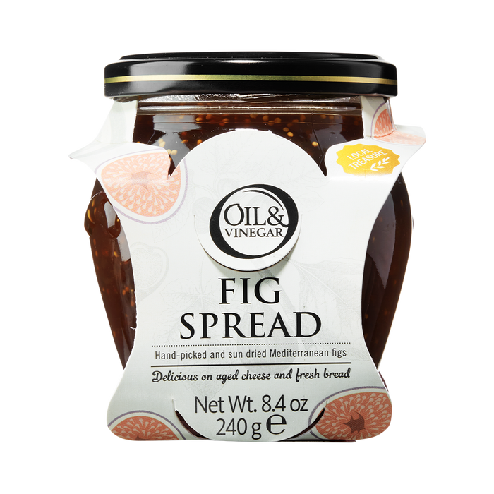 A glass jar of Oil & Vinegar brand Fig Spread with a white label showing figs and text, on a plain background.