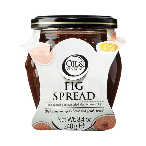 A glass jar of Oil & Vinegar brand Fig Spread with a white label showing figs and text, on a plain background.
