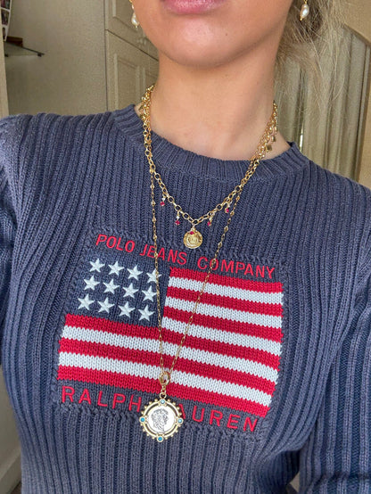 Iconic charm necklace styled for layering
