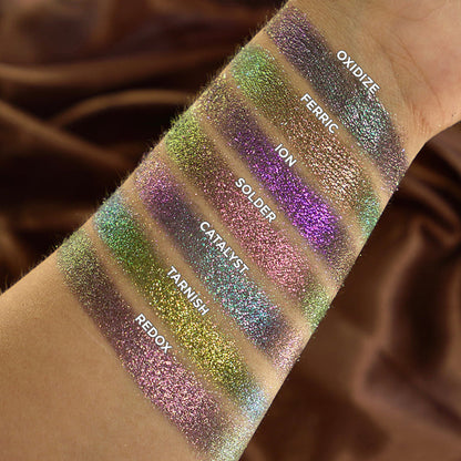 Arm swatches of Oxidize, Ferric, Ion, Solder, Catalyst, Tarnish and Redox on fair skin tone.