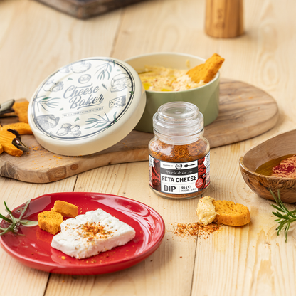 Feta cheese with a jar of feta cheese dip on a wooden table