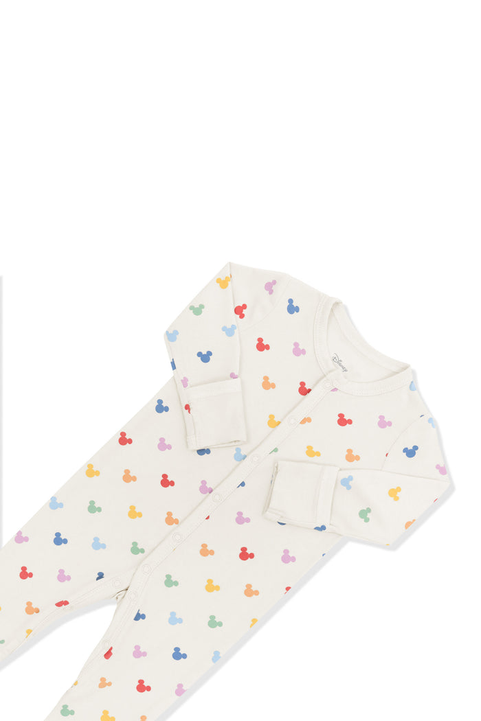 Top part of footie in pastel mickey mouse pattern on an oat background