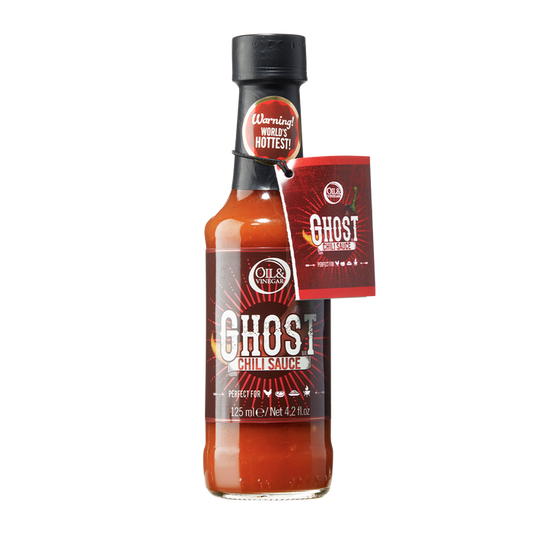 A bottle of Ghost Chili Sauce with a label indicating it is a spicy condiment made with Ghost Chili peppers.