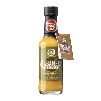 A bottle of Habanero Chili Sauce with a label and a brown cap