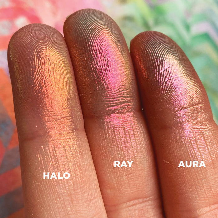 Left angled finger swatches of Halo Iridescent Multichrome Eyeshadow shifts compared to Ray, Aura