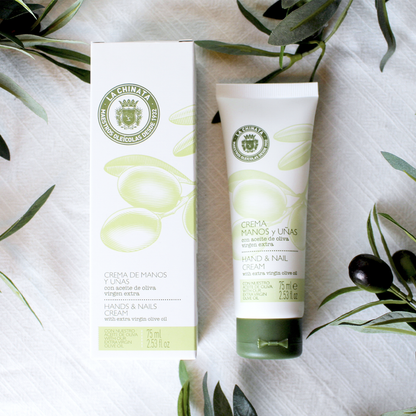Olive oil based hand cream bottle with the packaging beside it laying on a white background.