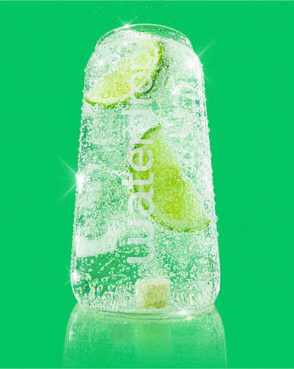 LEMON-LIME sparkling water with lime wedges and effervescent tablet.