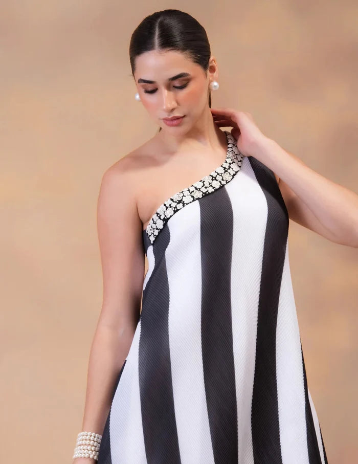 Model wearing the 'IVORY NOIR' FLOW DRESS featuring sophisticated patterns and luxurious fabric details in Singapore.