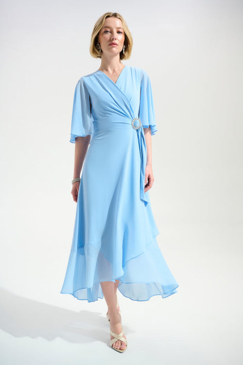 Joseph Ribkoff 261714 Sky Blue Signature Silky Knit Flowy Wrap Dress With Buckle Rhinestones Detail by joseph ribkoff shop at Dotique front view