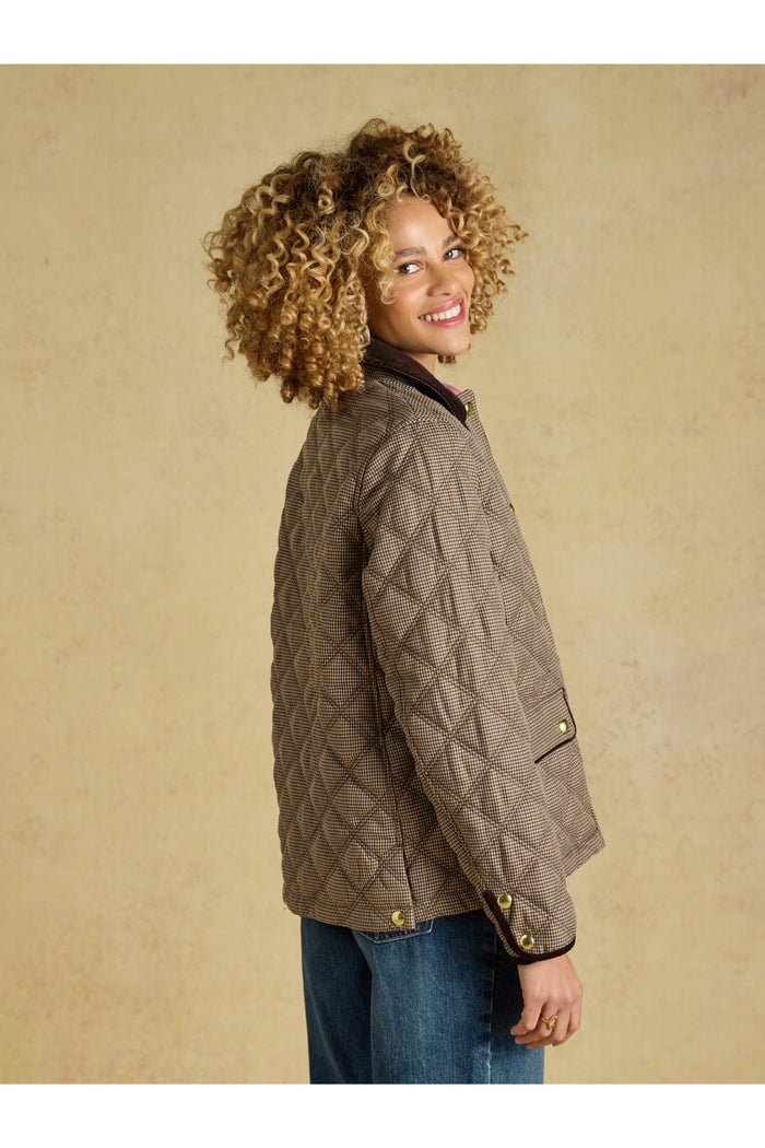 Smiling model wearing Joules Harrogate Check Coat Shop Joules at Dotique