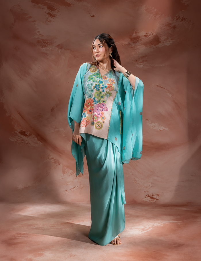 Blue Kaia embroidered kaftan-style top with waist tie-up paired with a flowing crepe drape skirt for women, perfect for festive and contemporary occasions.