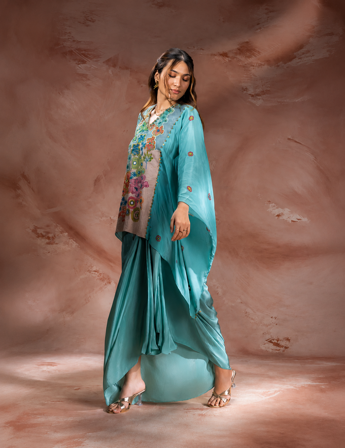 Blue Kaia embroidered kaftan-style top with waist tie-up paired with a flowing crepe drape skirt for women, perfect for festive and contemporary occasions.